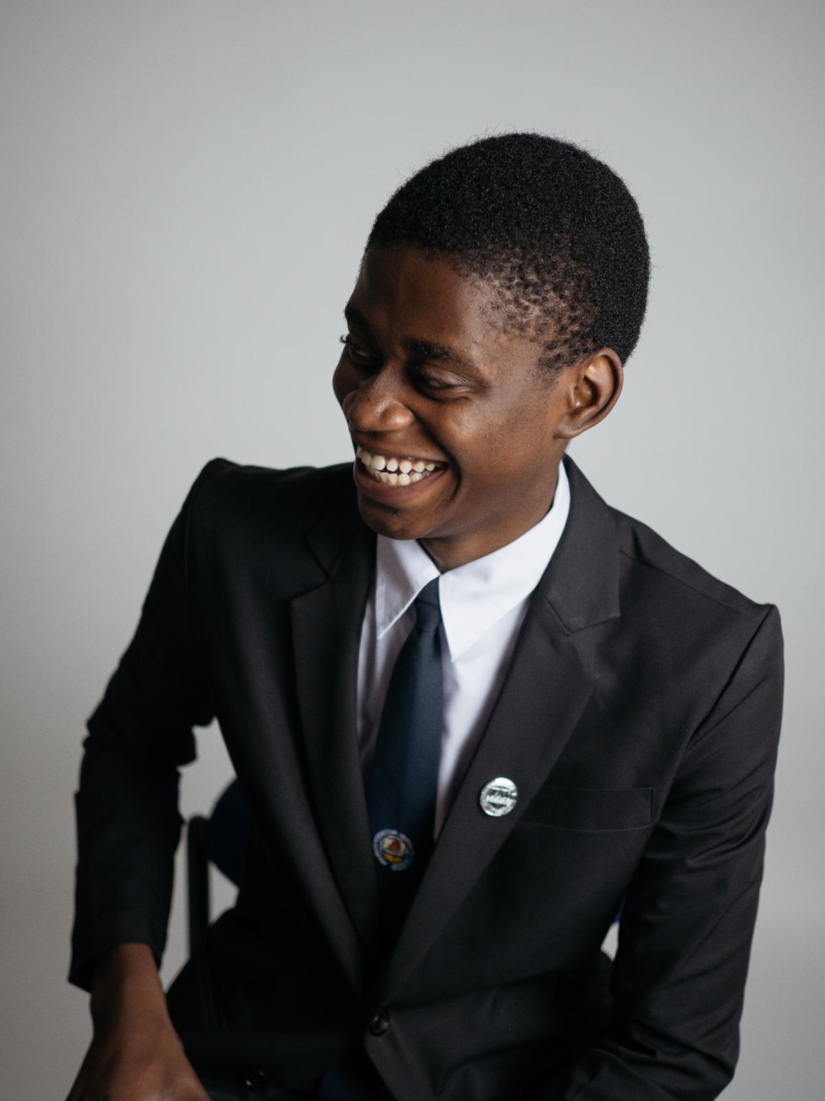 Photo of young black man in a business suit