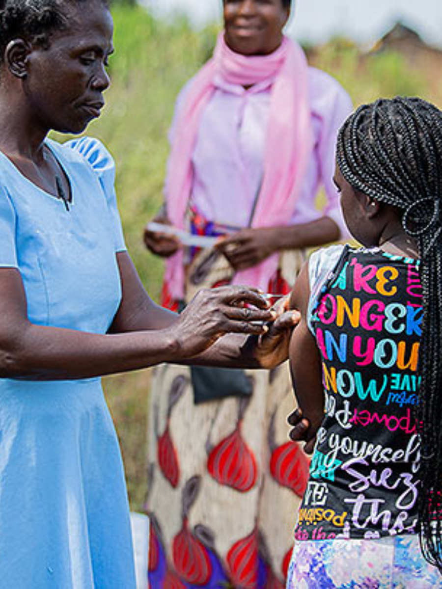 A child receives a shot in Malawi from a nurse