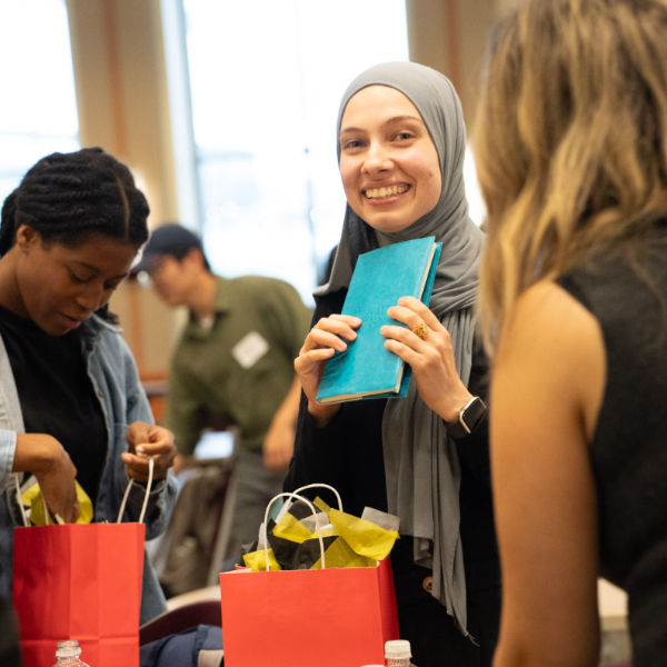 Students look through goody bags at the Global Kick Off
