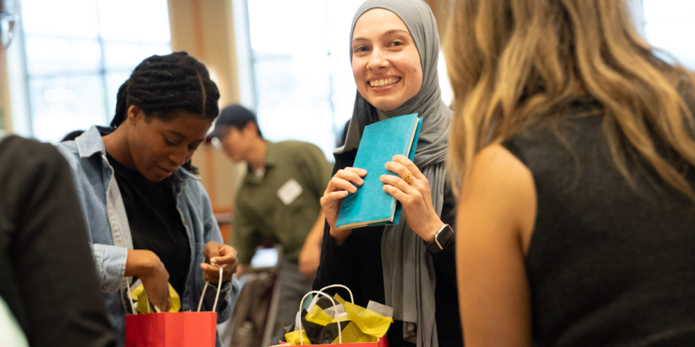 Students look through goody bags at the Global Kick Off
