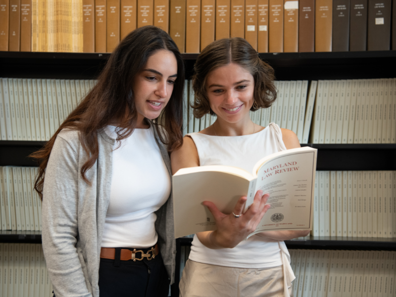 Students read a law book