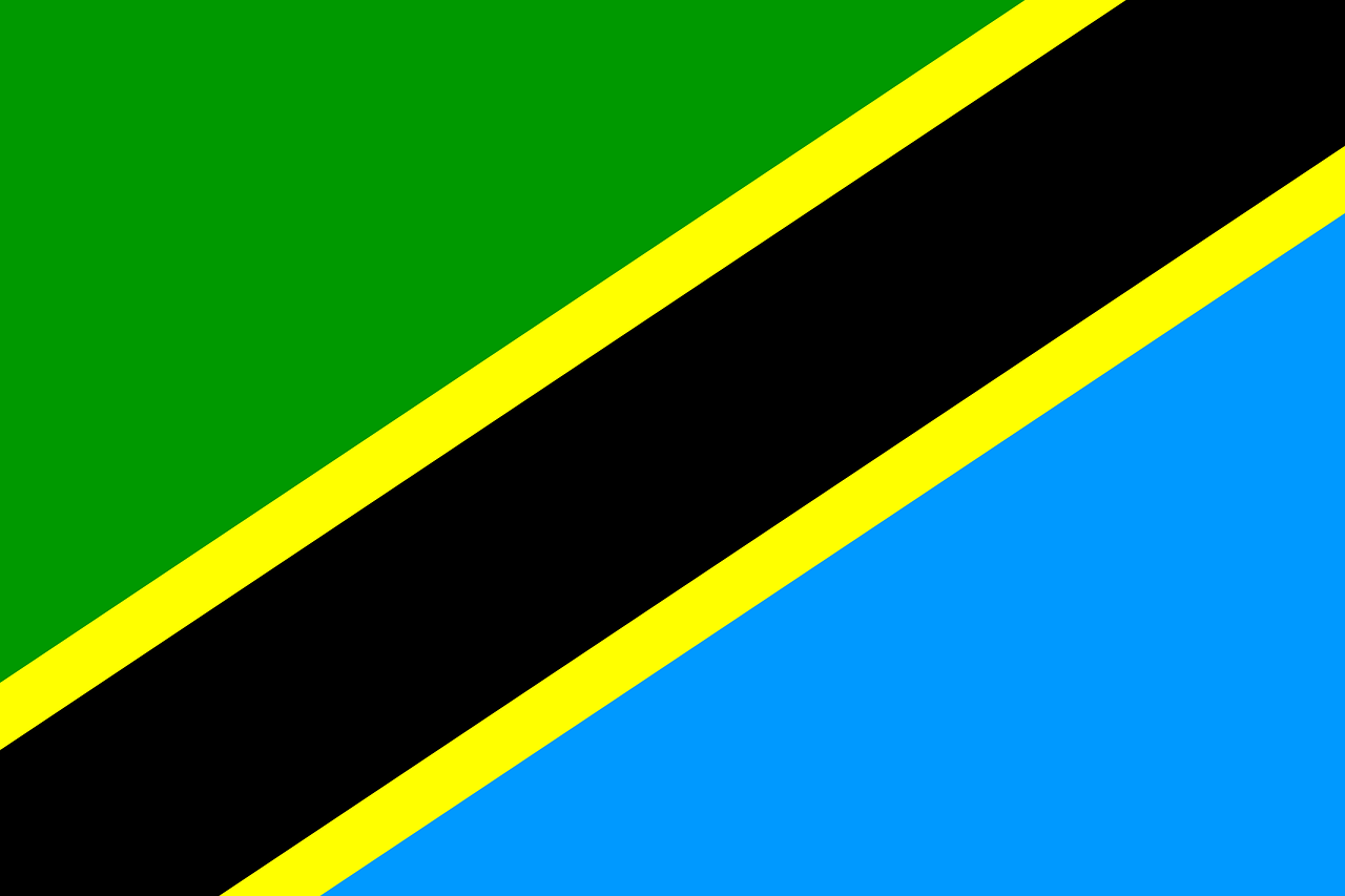 Flag of Tanzania with a green upper left corner divided from a blue lower right corner for a wide black diagonal line outlined by two small yellow lines