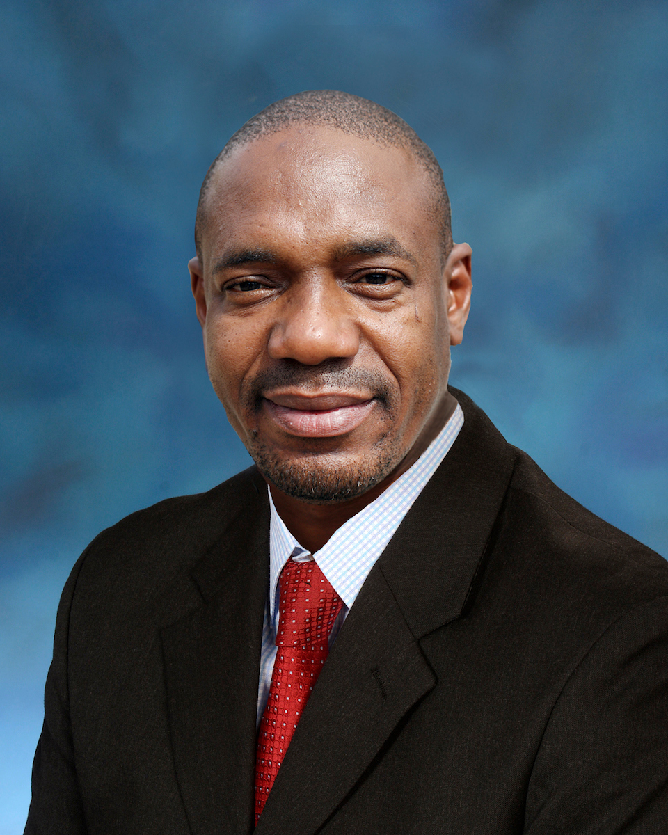 Headshot of man in a suit