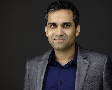 Headshot of man in suit