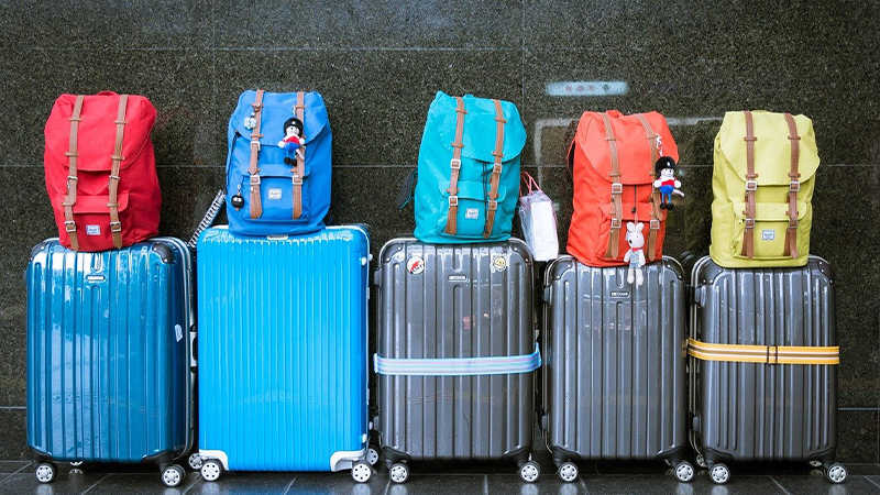 Row of luggage and backpacks