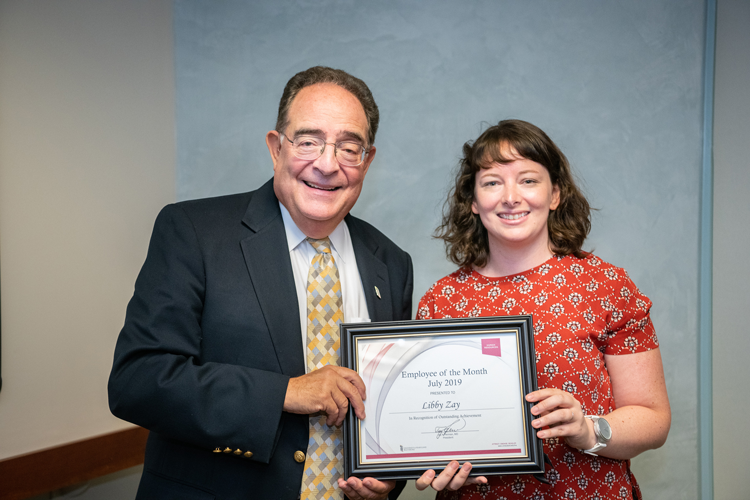 Elizabeth Zay, senior digital media specialist at UMSON, with President Perman.