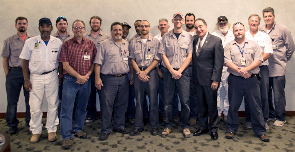 Vincent Cancelli and his co-workers with President Perman