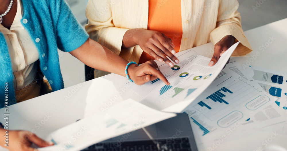 people looking at data on paper