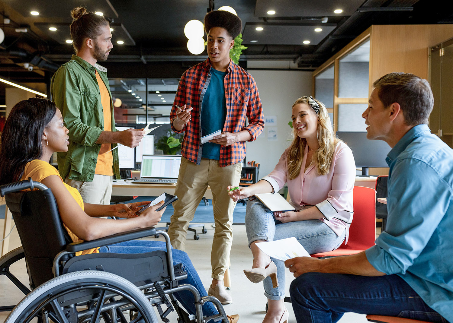 Diverse group of professionals meet informally