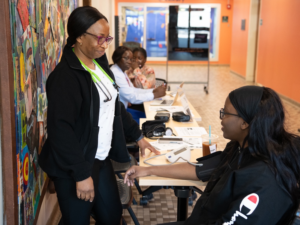 The University of Maryland School of Nursing faculty and students perform a health screening at a Prince George’s County Memorial Library location.