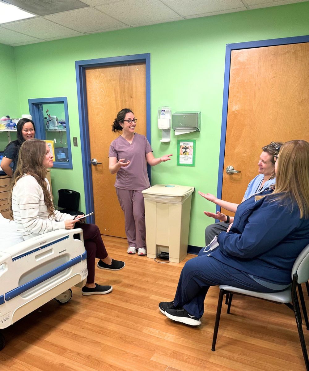 Erica Caffrey, DDS (center) meets with an interdisciplinary team at Kennedy Krieger.