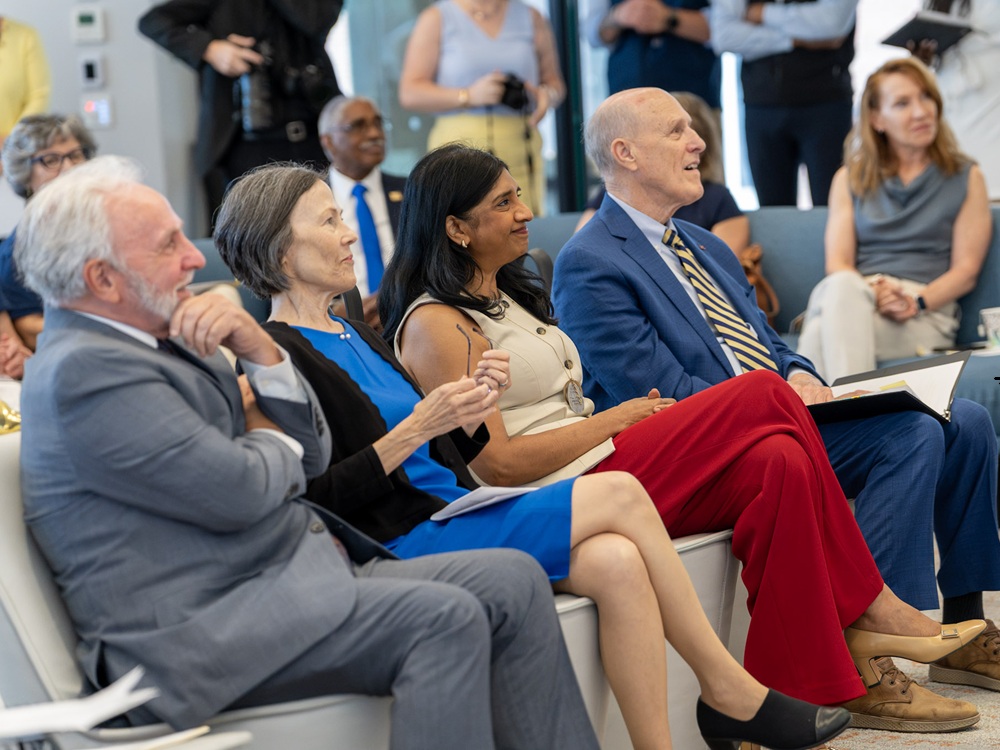 From left: Hank Greenberg, state director, AARP Maryland; Carmel Roques, secretary, Maryland Department of Aging; Aruna Miller, lieutenant governor of Maryland; and Bruce E. Jarrell, president, University of Maryland, Baltimore, listen to a speaker during the Age-Friendly Maryland ceremony.