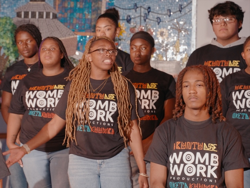 Students perform a scene from WombWork Productions’ What They Don’t See at the UMB Community Engagement Center.