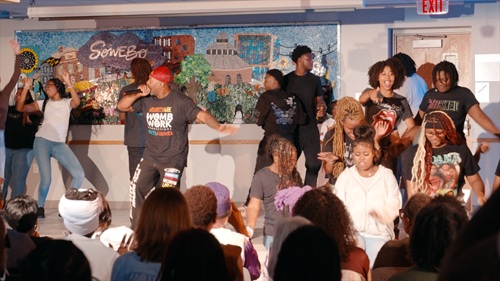 Students perform a scene from WombWork Productions’ 