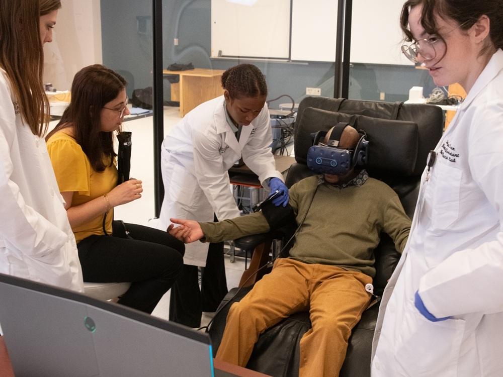 Showing that changing the future starts with research today, Dr. Luana Colloca (second from left) studies whether virtual reality can relieve chronic pain, potentially reducing reliance on opioids.