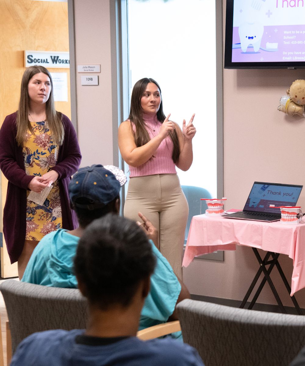 Dental hygiene students doing a presentation on oral health