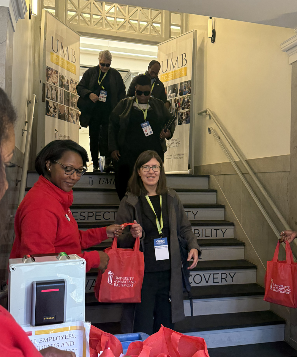 A CUMU participant leaves UMB's Community Engagement Center after attending a site visit.
