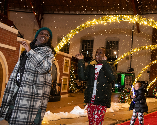Polar Express passengers walk through the entrance to the
