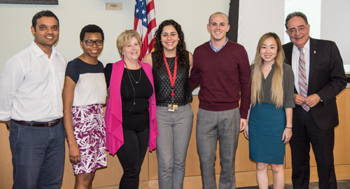 Simoni-Wastila with her students and postdocs, and Dr. Perman