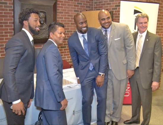 School of Dentistry Dean and Professor Mark Reynolds, DDS ‘86, PhD, far right, is joined by alumnus Michael Wright, DDS ’99, MS; second from left; and Washington Redskins players Kendall Fuller, far left; Vernon Davis, center, and A.J. Francis, MPP, second from right, in observing National Facial Protection Month. 
