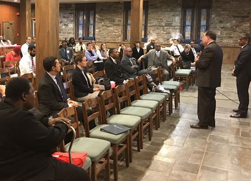 Dr. Mohan Suntha (far right) and Dr. Jay Perman (2nd from right) address community members gathered at Union Baptist Church.