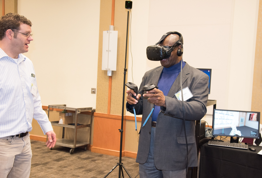 National Institutes of Health contractor Jeremy Swan helps Richard Bradberry, director of library services at Morgan State University, navigate a virtual anatomy program. 