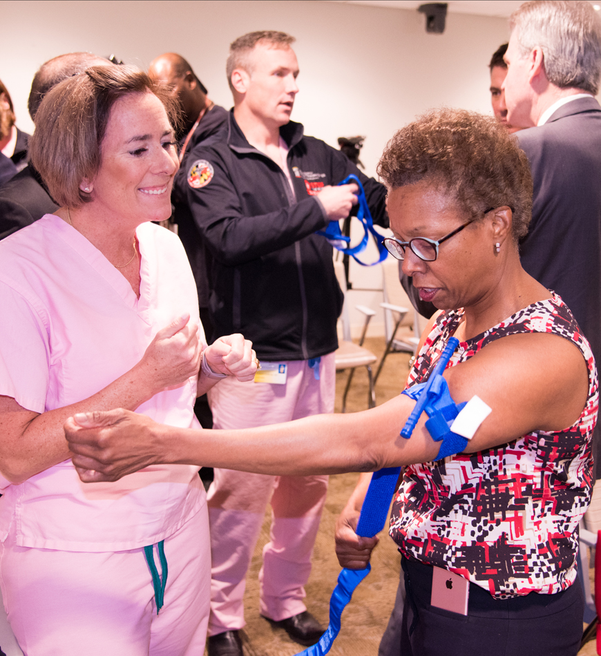 Natalie Eddington, PhD, FAAPS, FCP, professor and dean of the University of Maryland School of Pharmacy, learns tourniquet techniques during 