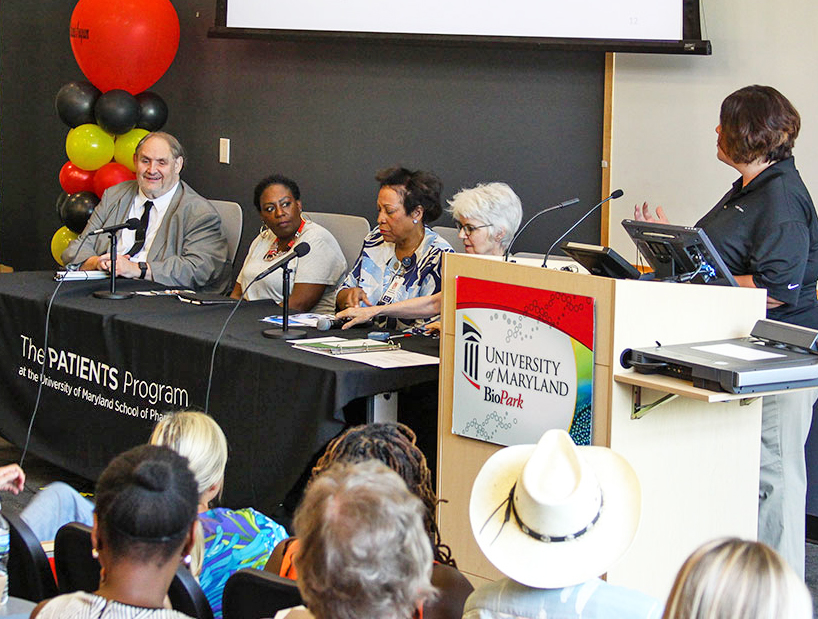 Daniel Frye, JD, left, spoke about his experience as a blind patient participating in research during a panel moderated by Michelle Medeiros, MS, MA, CCRP, director of research for the PATIENTS Program at the University of Maryland School of Pharmacy, right.