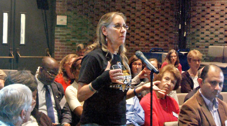 A mother seeking addiction treatment for her 22-year-old daughter asks the panelists for help during the question-and-answer session at the Wilde Lake Interfaith Center in Columbia, Md. 