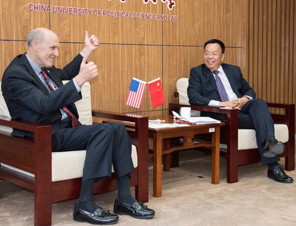 UMB Provost Bruce Jarrell, MD, FACS, reacts to CUPL Vice President Shi Jianzhong, PhD, as the two discuss a possible program in dental forensics.