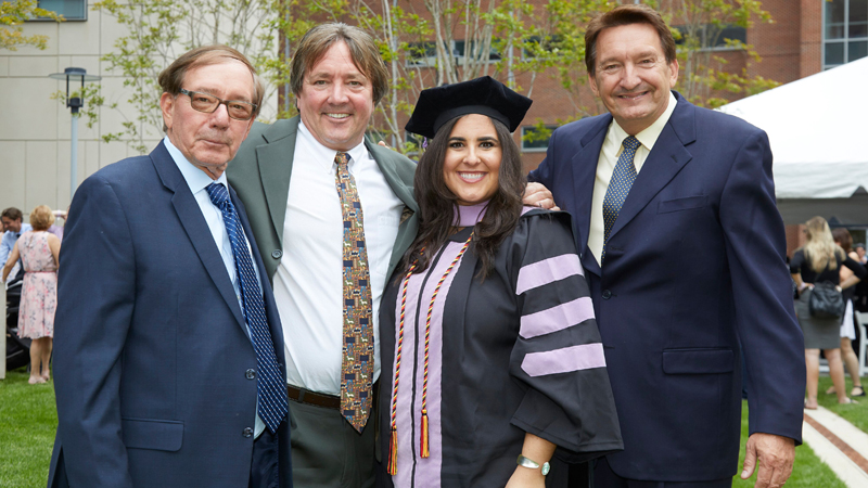 Left to right, Richard, Gary, and Robert Pawlak, who are the sons of the late Casimir Pawlak, and Gary’s daughter, Kathryn Pawlak, DDS ’19.