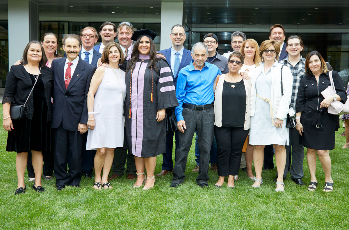 Kathryn Pawlak, DDS ’19, is shown at the University of Maryland School of Dentistry reception with her extended family, including the sons of Casimir Pawlak. They are Richard, fourth from left, Gary, seventh from left, and Robert, third from right.