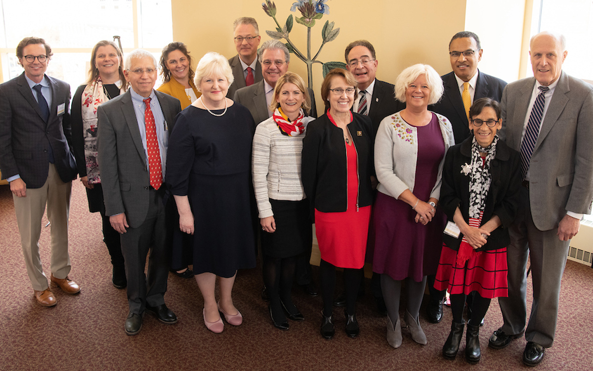 Members of the steering committee that guides the Age-Friendly University (AFU) partnership between the University of Maryland, Baltimore and the University of Maryland, Baltimore County gather with leaders of UMB, UMBC, and the University System of Maryland and Amy Berman, RN, LHD, FAAN (fifth from left), program officer of the John A. Hartford Foundation, which supports the AFU concept.