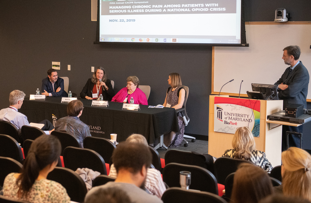 Panelist Beth Hogans, MD, PhD, MS, who holds positions at the VA Maryland Health Care System, Johns Hopkins University, and as adjunct associate professor of neurology at the UM School of Medicine, responds during a Q&A session conducted by Joel Greenspan, PhD, professor at the UM School of Dentistry and co-director of the UM Center to Advance Chronic Pain Research.