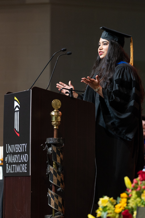 Graduating student Nivedita Hegdekar, PhD, MSL, introduced keynote speaker Dr. Anthony Fauci at UMB’s commencement ceremony May 19.