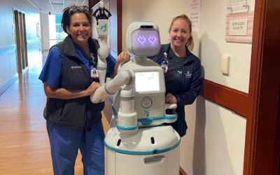 Staff members of Mary Washington Healthcare pose with Moxi, a robotic hospital assistant. Photo courtesy of Mary Washington Healthcare.