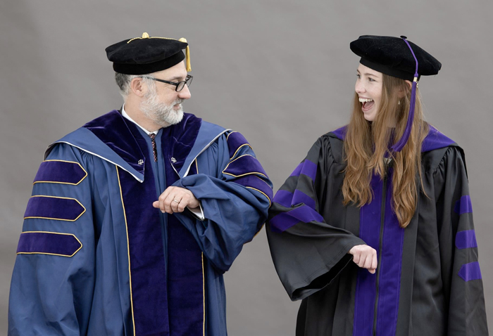 Francis King Carey School of Law Dean Donald B. Tobin, JD, shares a moment of fun with a Class of 2021 graduate.