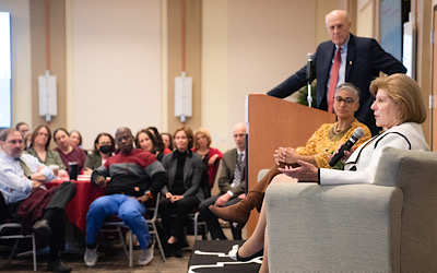 Bruce Jarrell and Renee Hutchins listen as Nina Totenberg addresses the audience.