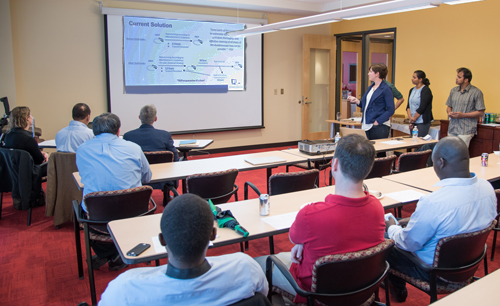 Students in Rana Quraishi's CIPP 980 entrepreneurship in biotechnology course listen to one another's final presentations.