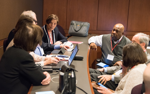 Participants at the Mid-Atlantic Global Pound Conference discuss one of the four key questions.