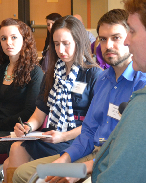 Students representing three disciplines assess a standardized patient on IPE Day.