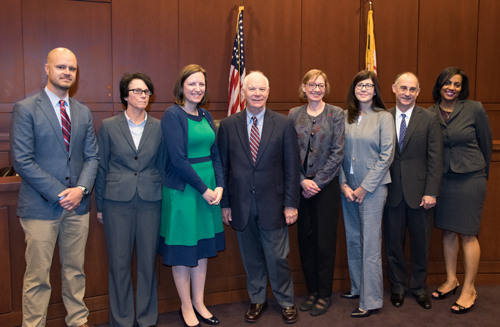 Adam Crandell, JD ’10, left, Elizabeth Atkinson, JD; Robin McKinney, MSW '01; Sen. Benjamin L. Cardin, JD ’67; National Taxpayer Advocate Nina E. Olson, JD; Angela Armstrong; Dean Donald B. Tobin, JD; and Beverly L. Winstead, JD ’08.