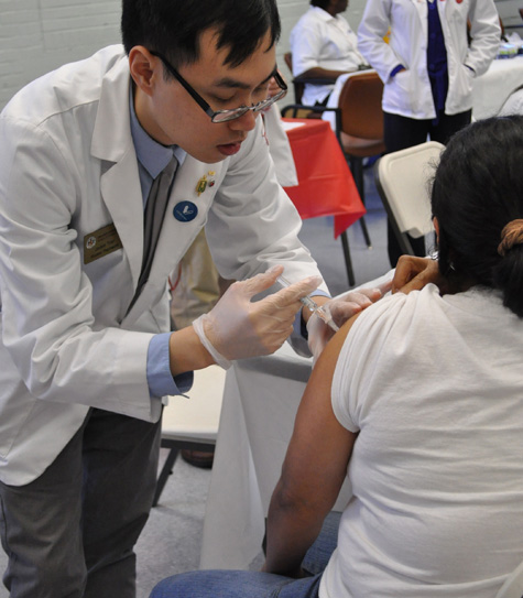 A voter in 2012 received a flu shot at a clinic organized by University of Maryland School of Pharmacy students and faculty as part of a national initiative. 