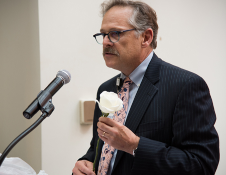 Leonard Taylor, Jr., MFA, MBA, senior vice president for operations and support systems at the University of Maryland Medical Center, captured students' attention with a rose.  