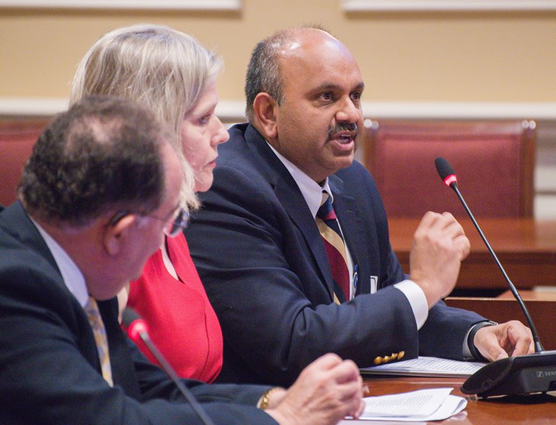 Dr. Amitabh Varshney speaks as Drs. Sarah B. Murthi and Jay A. Perman look on.