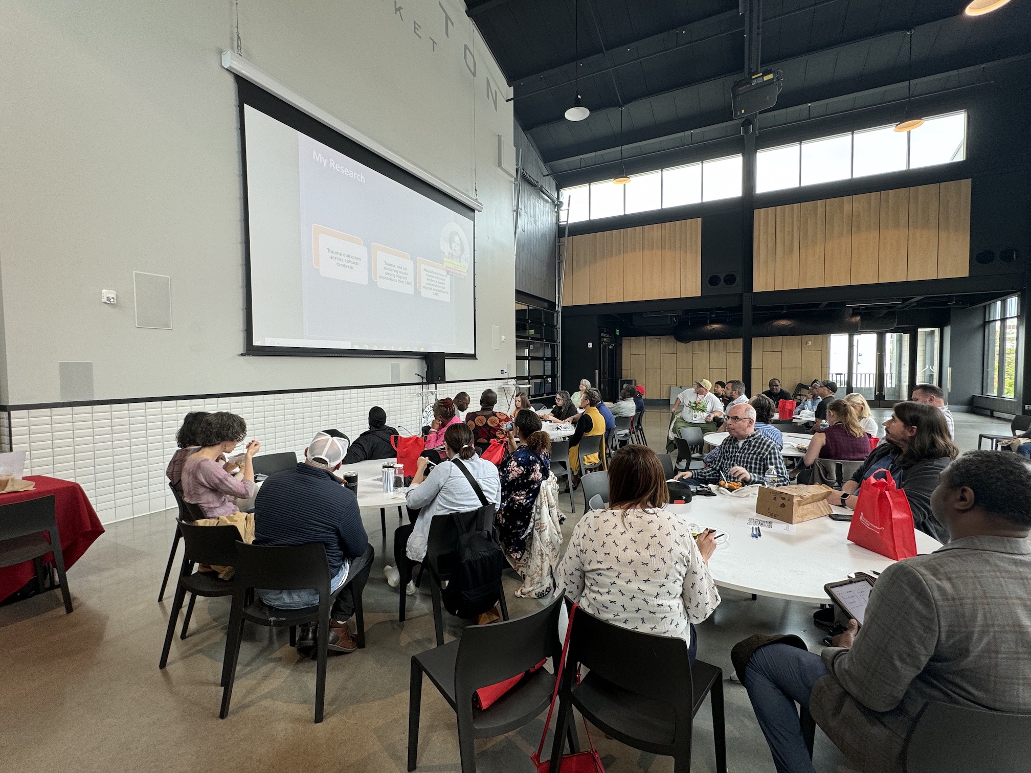 Attendees of the Lexington Market Day event enjoy a delightful meal while engaging with the insightful presentation. A perfect blend of community, cuisine, and conversation!