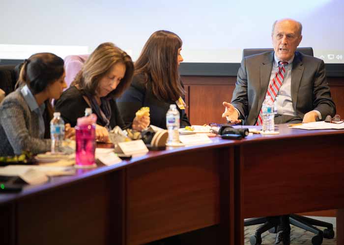 Bruce Jarrell, MD, FACS, the interim president of the University of Maryland, Baltimore (right), addresses the President's Council for Women at its second official meeting. 