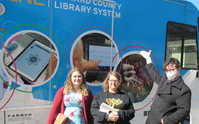 (L-R) Tax clinic student Cedar Bauer with a client (center) and Chris Heady, Howard County Public Library.