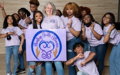 Healing Youth Alliance founder Kyla Liggett-Creel, right center, with the third cohort of HYA ambassadors. View a slideshow of the ambassadors above. 