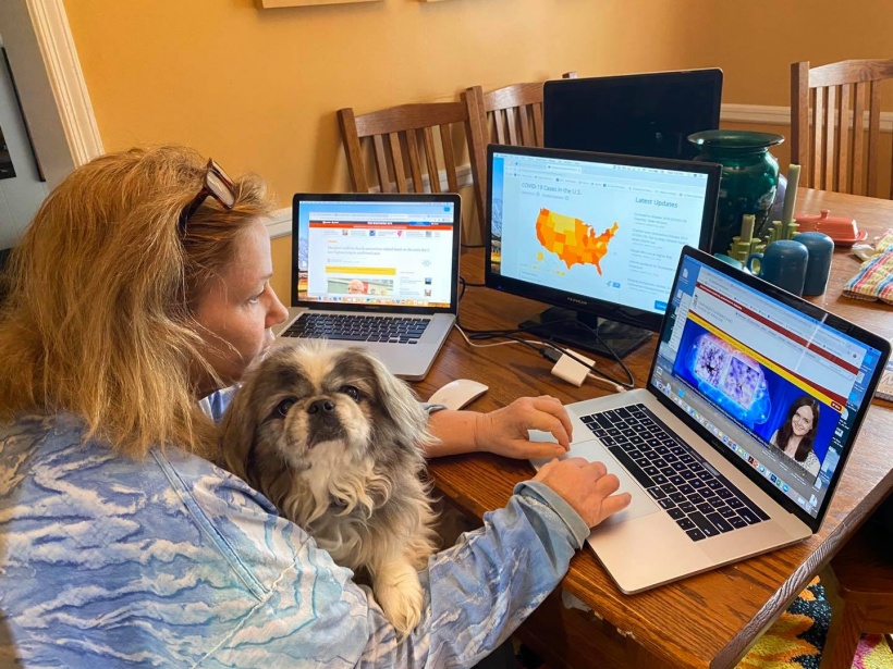 Joanne Morrison, director of marketing and public relations for the University of Maryland School of Medicine, teleworks with her dog, Ben.